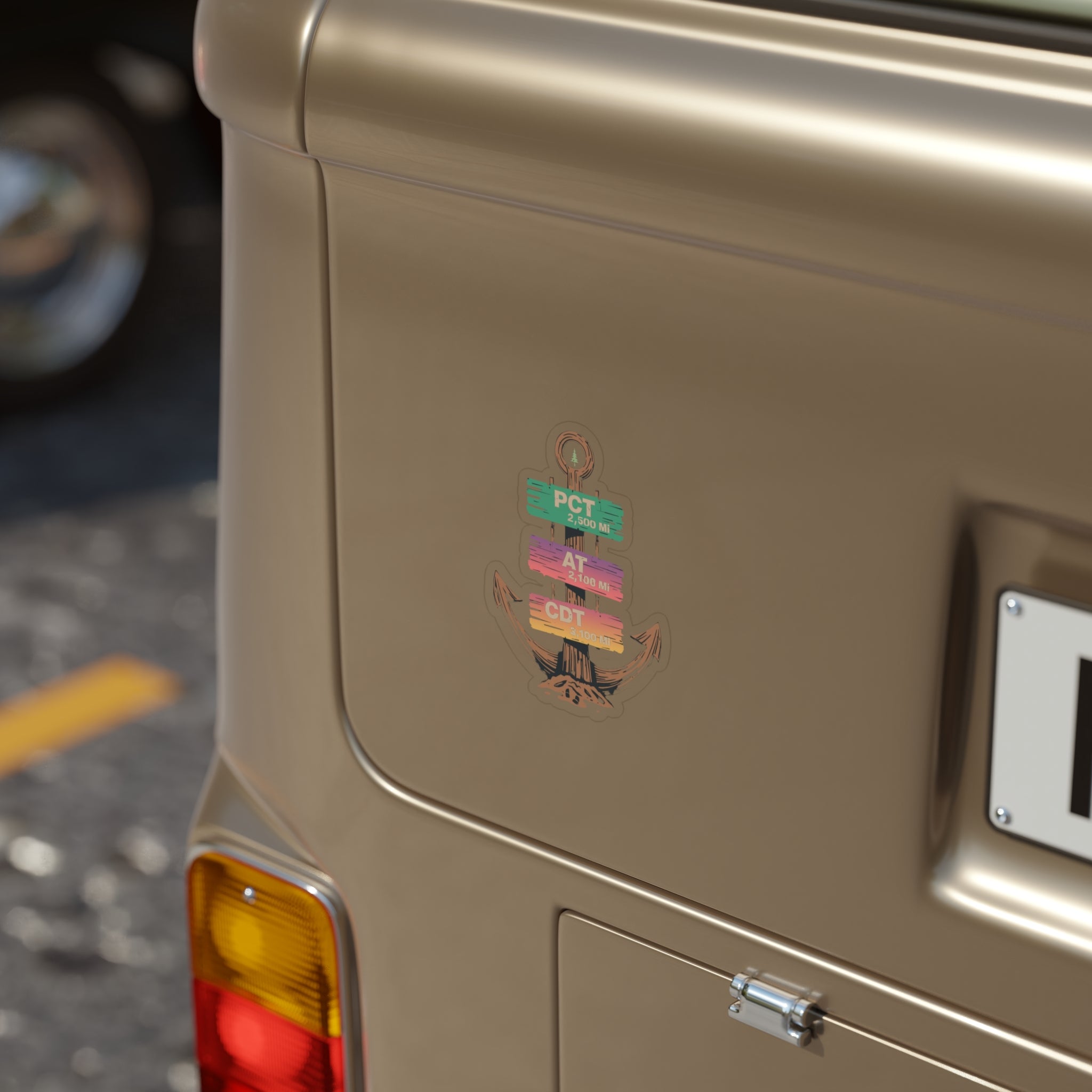 Close-up of a vintage car's rear with a visible badge on a blurred background